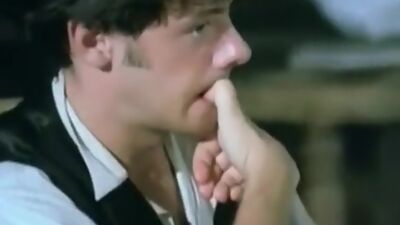 Hairy pussy fingering under the table in this vintage porno video