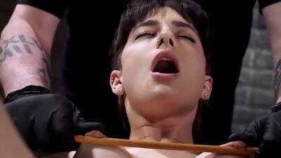 Slave in a predicament position whipped