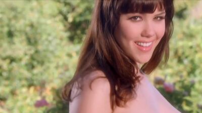 All natural beauty Claire Sinclair showing her big tits in a fountain