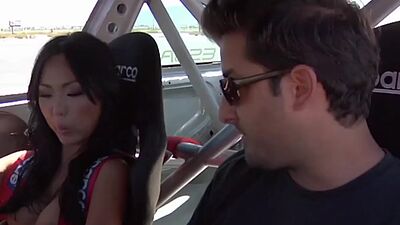 Naked badass asian babe and her GFs  jump into race cars for a wild ride