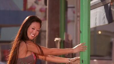 Exotic asian beauty Grace Kim stripping during playing on a guitar