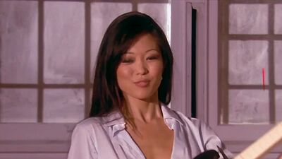 Exotic asian beauty Grace Kim stripping during playing on a guitar