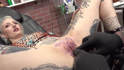 River Dawn INK Gets Her Pussy Tattooed While Blowing Sascha