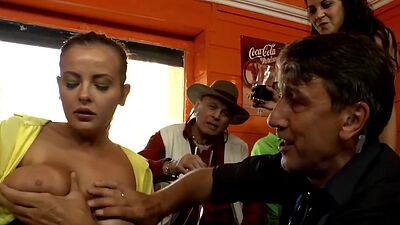 Busty public sub sucking dom dick in group with voyeurs