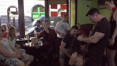 Publicly humiliated sub sucking cock with voyeurs watching