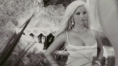 Big boobed blonde Spencer Scott reveals her shaved pussy in the rain