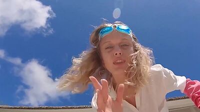 Skinny blonde ukrainian teen Clarise reveals her small tits in the pool