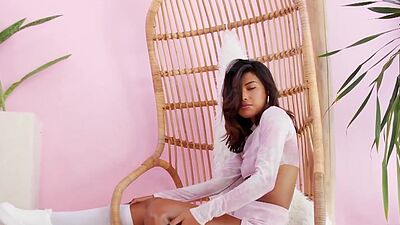 Petite asian beauty Moana Rosi flashes her small tits in a hammock