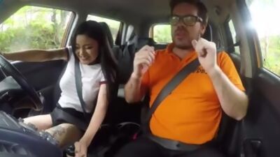Inked Asian babe pussy licked by driving tutor during sex