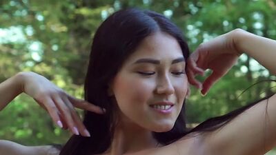 Petite small titted mongolian babe Kimiko stripping on a flowery meadow