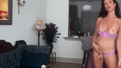 Busty lingerie ts showing off body while jerking off