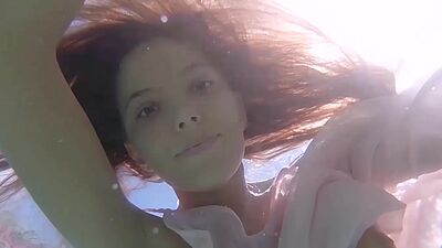 Petite Russian beauty Katya Clover showing her shaved pussy under the water