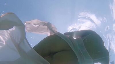 Petite Russian beauty Katya Clover showing her shaved pussy under the water