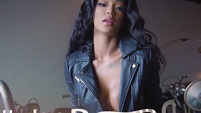 Big booty ebony MILF Harley Dean strips nude in a motorcycle work shop