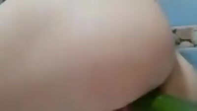 Having fun with a cucumber in the shower