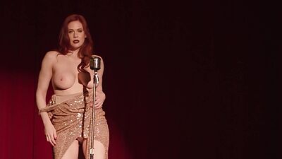 Big natural tits mature redhead MILF model Maitland Ward performs on stage