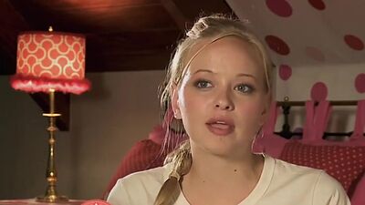 Big boobed naked blondie Danielle Mathers posing on a horse outdoor