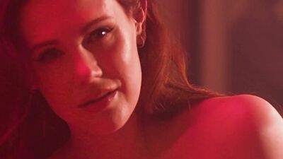 Amazing big boobs MILF Maitland Ward posing on the piano and striptease