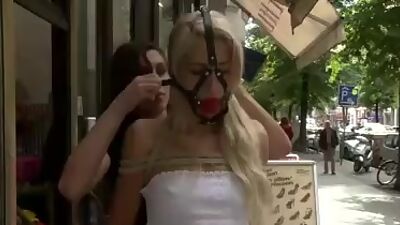 Blond gagged and bound in public