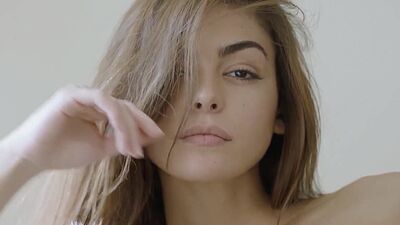 Cute blonde model with perfect booty Francy Torino posing on the beach