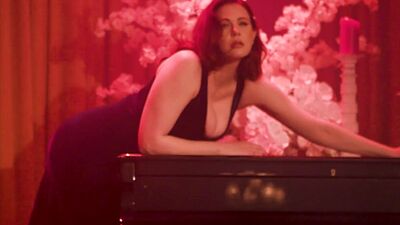 Glamorous big boobed redhead MILF Maitland Ward stripping on the piano