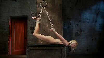 Hogtied blonde suffers suspension