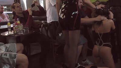 Submissive useless babe in high heels deepthroats in public