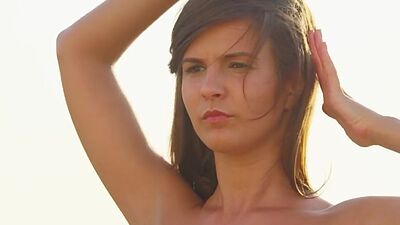 Solo erotic brunette teen with small tits poses outdoor