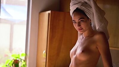 Skinny latina babe Sarah Mollica flashes her small tits and takes a shower