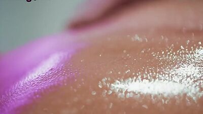 Oiled massaging lesbians lick and finger wet pussies