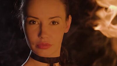 Teen Elilith Noir playing with fire and posed totally naked in the dark