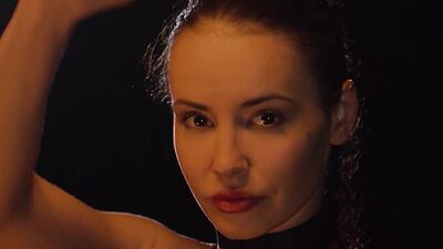 Teen Elilith Noir playing with fire and posed totally naked in the dark