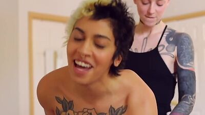 Tattooed amateur lesbians in sensual strapon vaginal sex