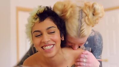 Tattooed amateur lesbians in sensual strapon vaginal sex