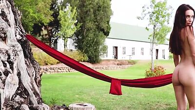 Ukrainian beauty Gloria Sol flashes her massive tits at a lavender field