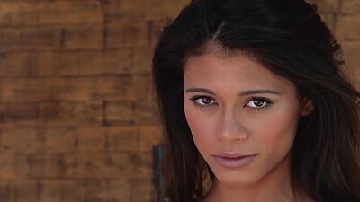 Petite small titted latina babe Hannah Le performing a sensual striptease