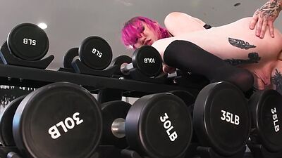 Tattooed tranny anally fucked in gym by tattooed male fucker