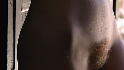 Long legged babe Erna Ohara stripping and washing her hairy redhead pussy