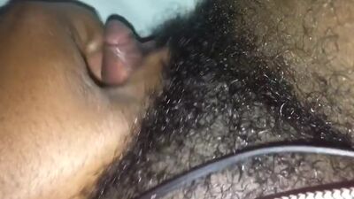 Masturbating her big clit.