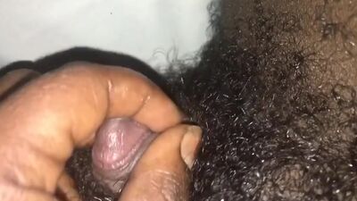 Masturbating her big clit.