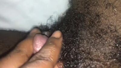 Masturbating her big clit.