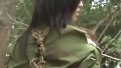 Chinese army girl tied to tree