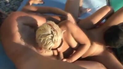 Crazy FFFM orgy on the nude beach 9