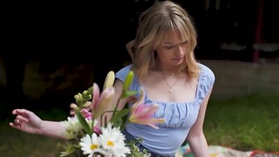 Cute blonde teen model posed in the park and exposed her beautiful tits