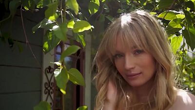 Cute blonde teen model posed in the park and exposed her beautiful tits