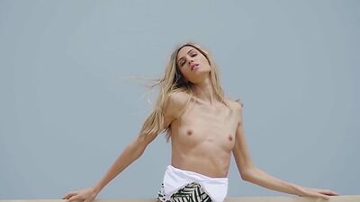 Super skinny blonde Italian babe Francy Torino stripping at a pier outdoor