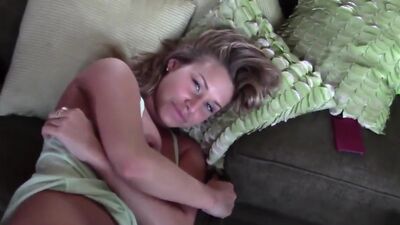 Lovely busty babe stuffed on the couch