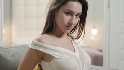 Young beauty takes off her clothes for erotic seduction