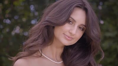 Nude all natural latina babe Eliza Ibarra showing her big boobs on a horse