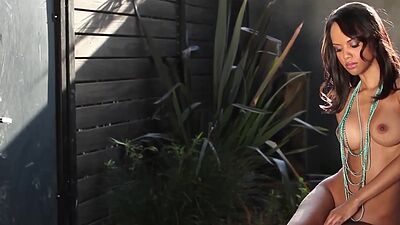 Hungarian ebony babe Amina Malakona reveals her freshly shaved black pussy